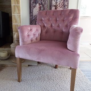 Buttoned armchair after