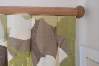 Inverted pleats on wooden rod